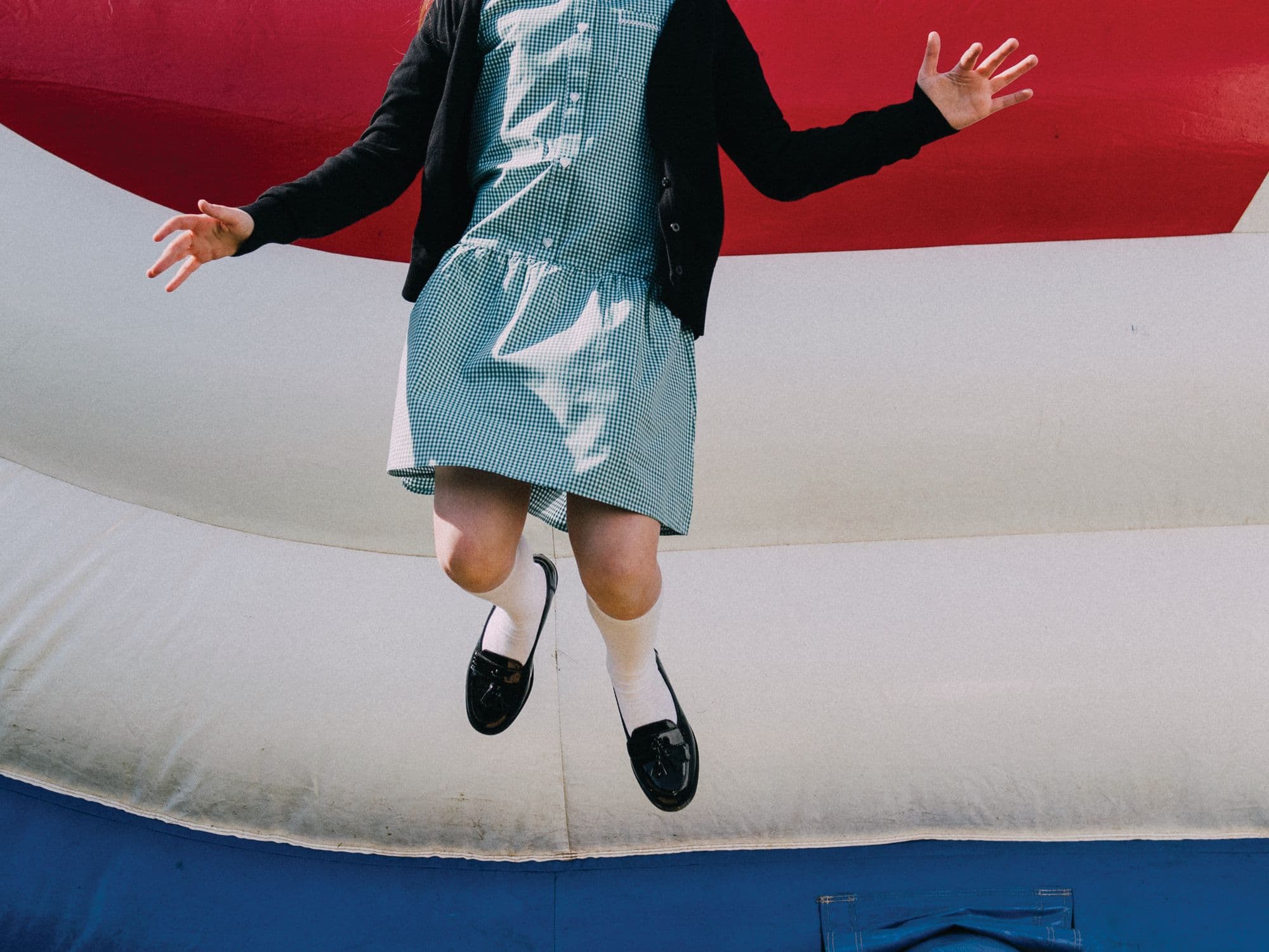 Child jumping on a bounce house