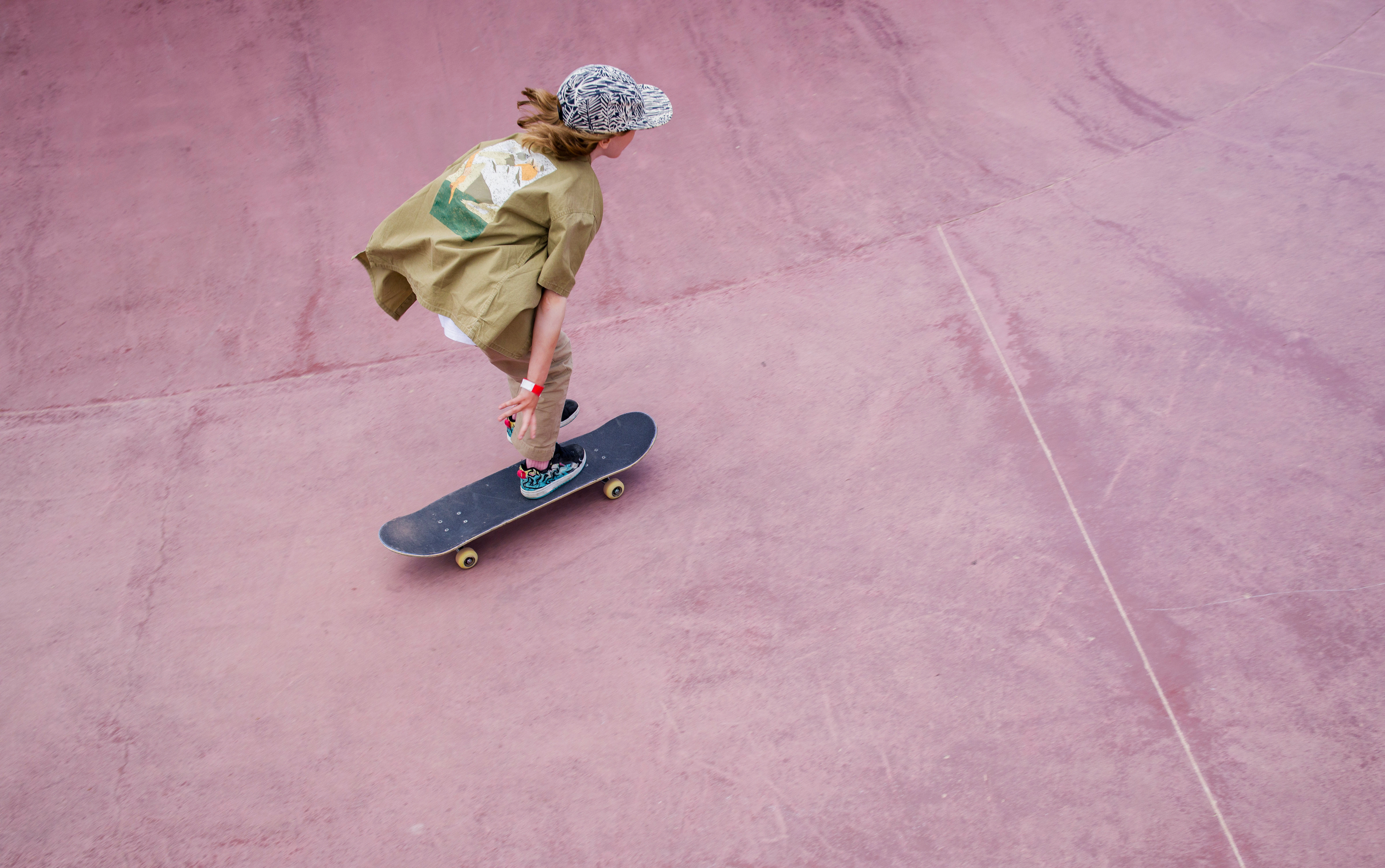 Child skateboarding outdoors